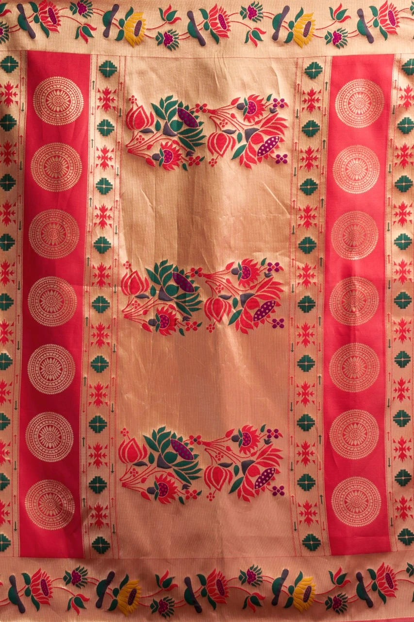 Traditional embroidered fabric with pink and green patterns on a beige background